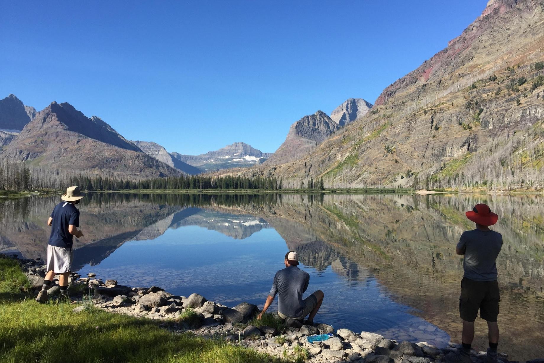 People Fishing On Lake